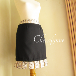 Black Skirt with Loops Detail at The Hem